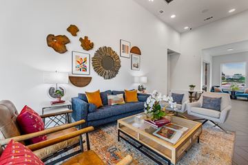 Red Oak apartment for rent - A living room with a blue couch and a coffee table.