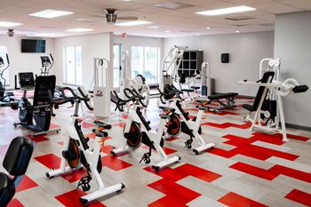 A gym with a red and white checkered floor.