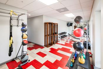 A gym with a red and white checkered floor.