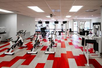 A gym with a red and white checkered floor.