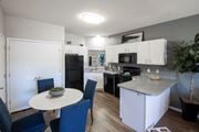 Memphis apartment for rent - A kitchen with a table and chairs. at Park at Forest Hill Apartments, Memphis, TN, 38125