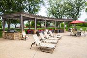 Overland Park townhouse for rent - Enjoy lounging poolside under the pergola at Pointe Royal in Overland Park, KS