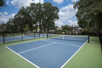 Overland Park townhouse for rent - Enjoy a round of tennis on our courts at Pointe Royal in Overland Park, KS