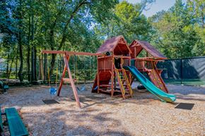 Norcross apartment for rent - a swing set with a jungle gym in the middle of a park  at Grove Point, Georgia