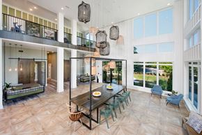Marietta apartment for rent - Gathering tables and loungers within the clubhouse at The Barrett, Georgia