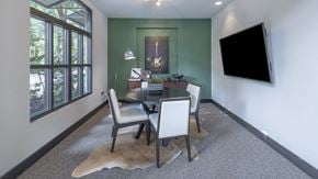 Atlanta apartment for rent - a dining room with a table and chairs and a television at The Hendrix, Atlanta, GA, 30329