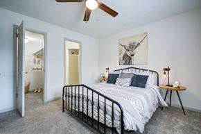 Little Rock apartment for rent - Bedroom with large bed at The Waters at Chenal Apartments, Little Rock, AR, 72211