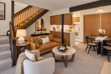 Akron apartment for rent - A living room with a brown sofa and a coffee table.