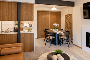 Akron apartment for rent - A modern kitchen with a dining table set for two.