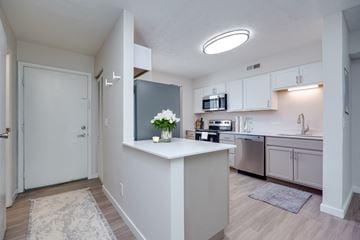 Middletown apartment for rent - A kitchen with a white counter and a microwave on it.