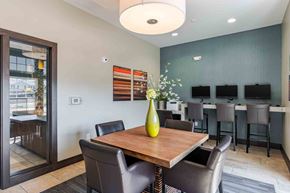 Louisville apartment for rent - A dining room with a wooden table and chairs.