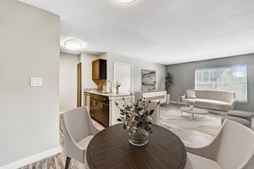 Broken Arrow apartment for rent - A modern living room with a dining table and chairs.