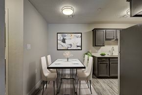 Oklahoma City apartment for rent - A dining room with a table set for four.