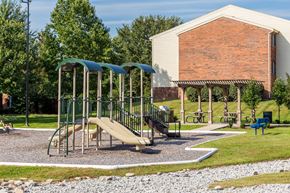 Georgetown apartment for rent - A playground with a slide and a green canopy.