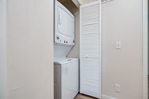 Middletown apartment for rent - A white dishwasher is in a narrow space between a wall and a microwave.