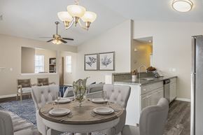 Webster apartment for rent - a dining area with a table and chairs and a kitchen in the background