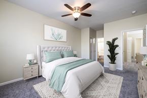 Wexford townhouse for rent - an open bedroom with a bed and a ceiling fan