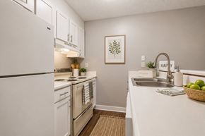 Gaffney apartment for rent - A kitchen with white appliances and a white counter top.