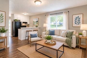 Gaffney apartment for rent - A living room with a white couch and a coffee table.