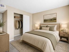 Georgetown apartment for rent - A bedroom with a large bed and a painting on the wall.
