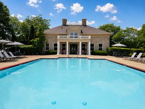 Columbus townhouse for rent - A large house with a pool in front.