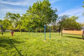 Rosedale apartment for rent - A park with a playground and a bench.