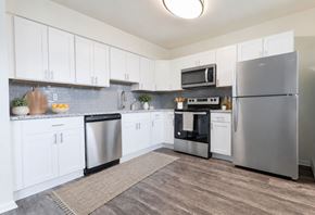 Lansdale apartment for rent - A kitchen with white cabinets and a stainless steel refrigerator.