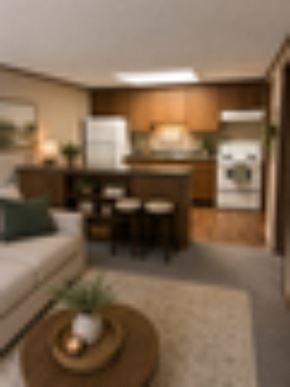 Kent apartment for rent - A small white couch with a green pillow is in a living room.