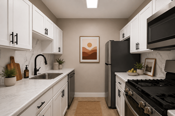 Merriville apartment for rent - A kitchen with white cabinets and a black stove top oven.