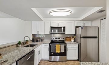 West Palm Beach apartment for rent - A modern kitchen with stainless steel appliances and granite countertops.