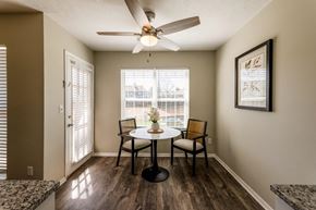Dayton apartment for rent - A dining room with a table and chairs and a ceiling fan.