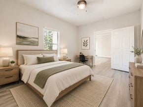 Lancaster townhouse for rent - A bedroom with a large bed and a window with blinds.