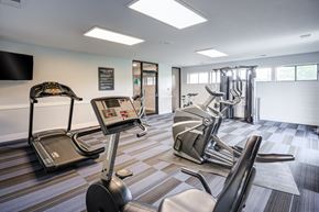 Indianapolis townhouse for rent - A gym with treadmills, elliptical machines, and other exercise equipment.
