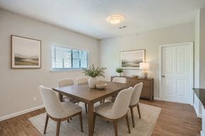 Fort Worth townhouse for rent - A dining room with a wooden table and chairs.