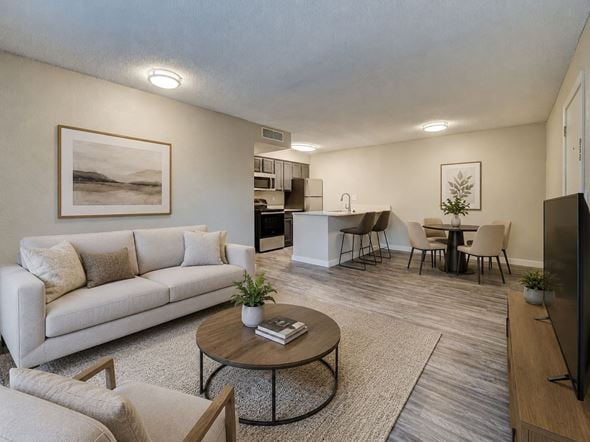 Oklahoma City apartment for rent - A living room with a white couch and a coffee table.