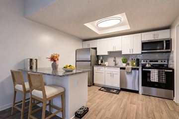 Columbus townhouse for rent - A kitchen with a counter and a chair.