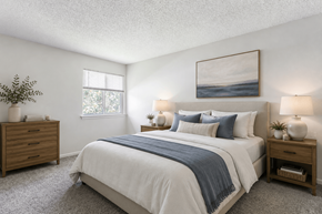 Columbia townhouse for rent - A bedroom with a large bed and a painting on the wall.