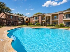 Lancaster townhouse for rent - A swimming pool in front of apartment buildings.