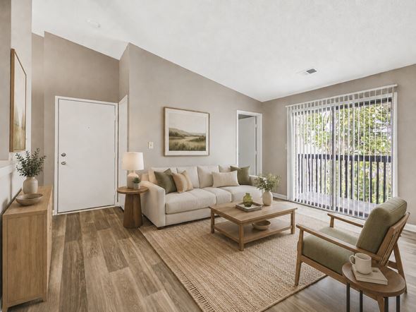 Georgetown apartment for rent - A living room with a white couch, a wooden coffee table, and a painting on the wall.