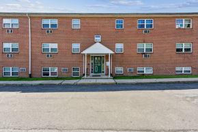 Reading apartment for rent - the front of a brick building with a green door