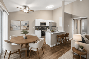 Centerville apartment for rent - A modern kitchen with a dining table and chairs.