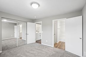 Centerville apartment for rent - A spacious room with a grey carpet and white walls.