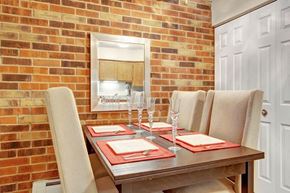 Elgin apartment for rent - a dining room with a table and chairs