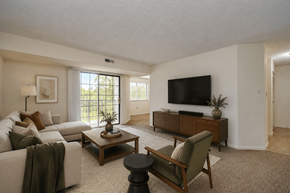 Cincinnati apartment for rent - A living room with a couch, chair, and television.