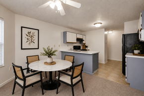 Cincinnati apartment for rent - A dining room with a white table and chairs.