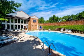 Cincinnati apartment for rent - A pool with a building behind it.