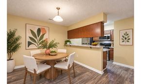 Fayetteville apartment for rent - A dining room with a table and chairs.