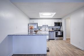 Kent apartment for rent - A kitchen with a marble countertop and stainless steel appliances.