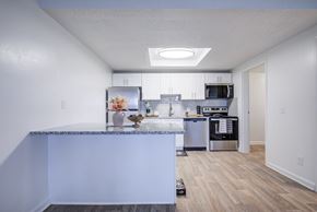 Hilliard apartment for rent - A kitchen with a marble countertop and stainless steel appliances.