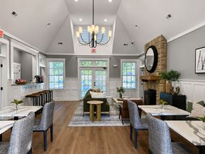 Wexford townhouse for rent - A dining room with a chandelier, a fireplace, and a mirror on the wall.